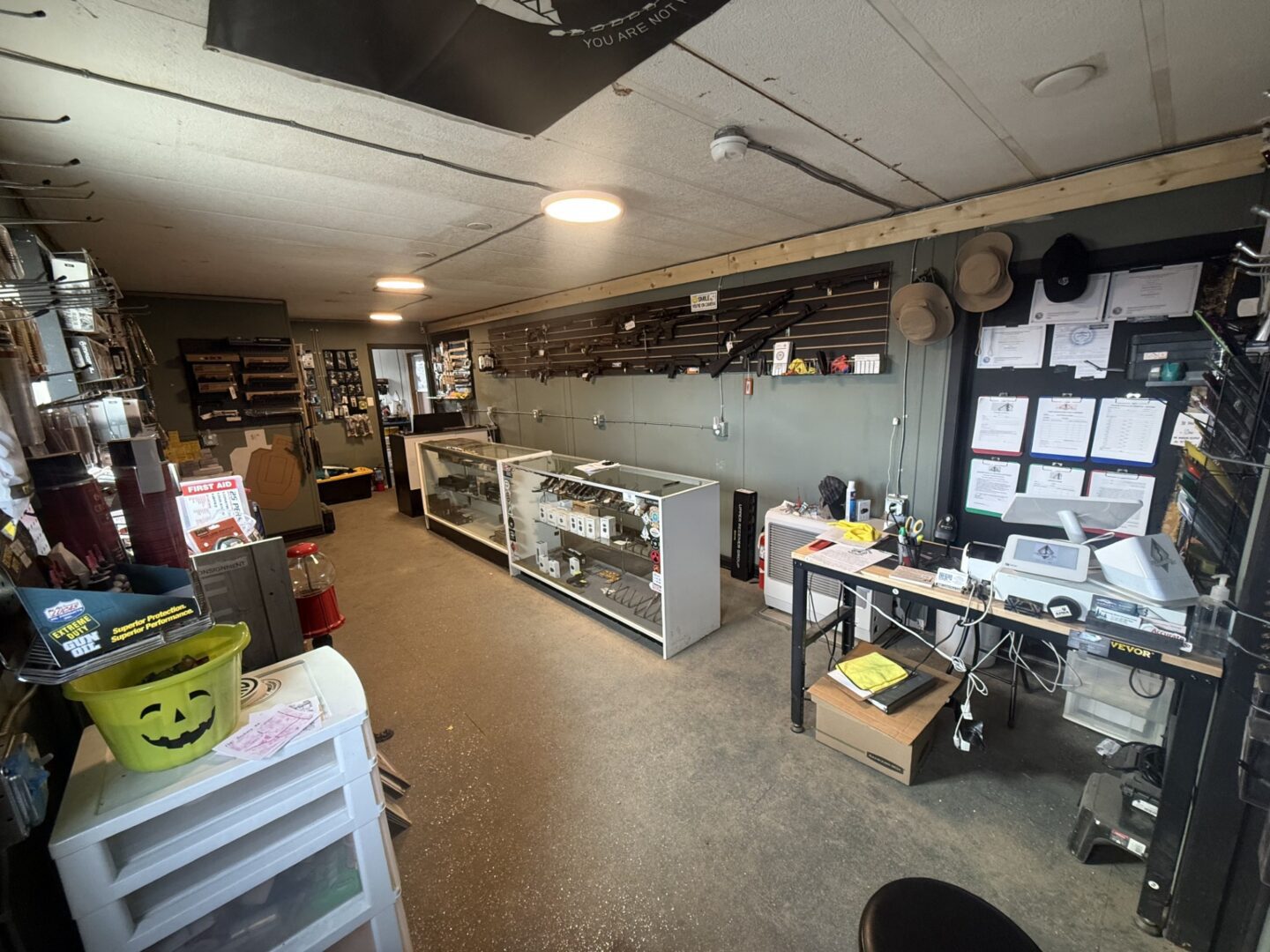 Inside gun store at front door